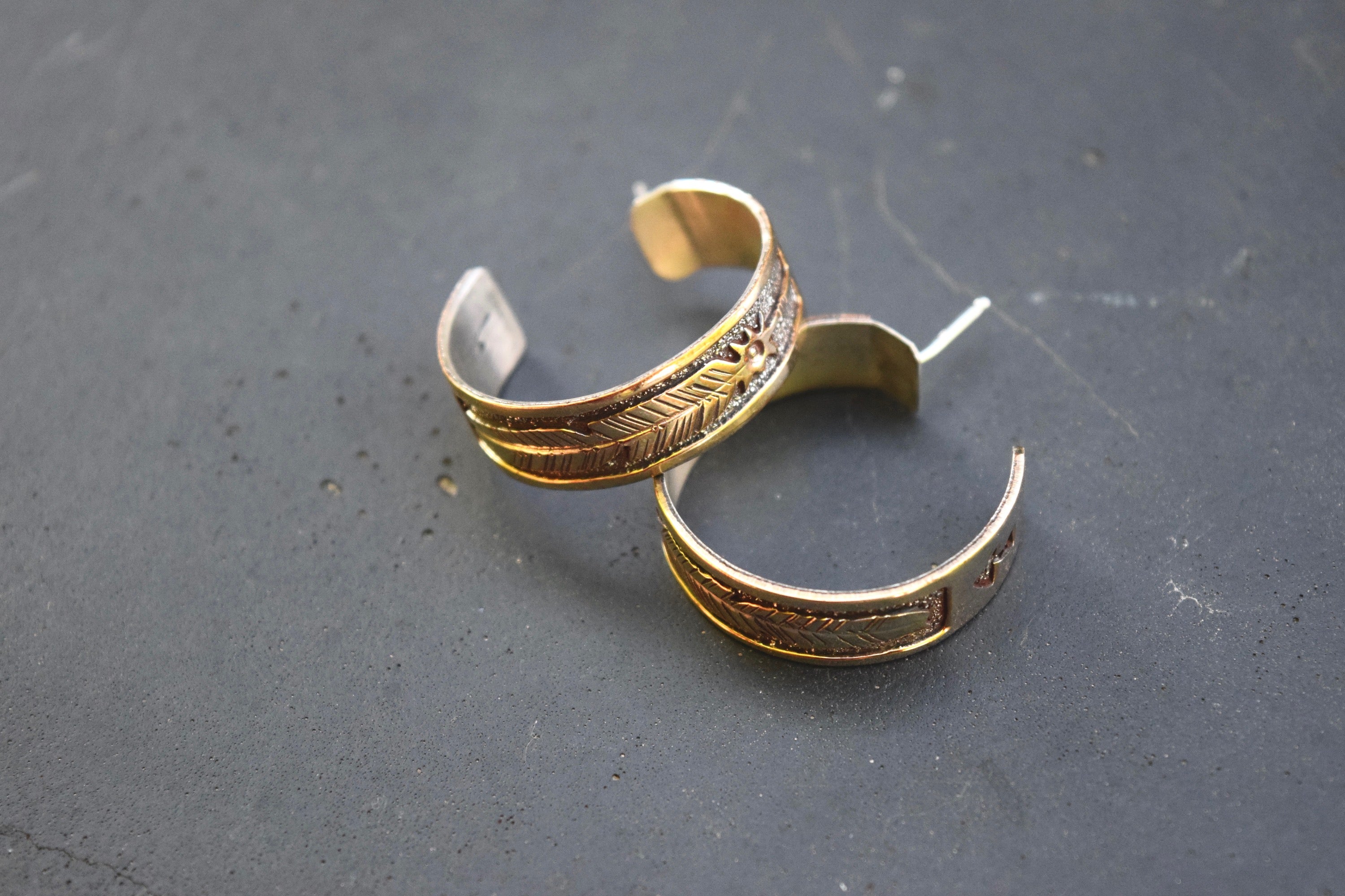 SILVER AND GOLD FEATHER HOOPS FROM THE RODGERS COLLECTION