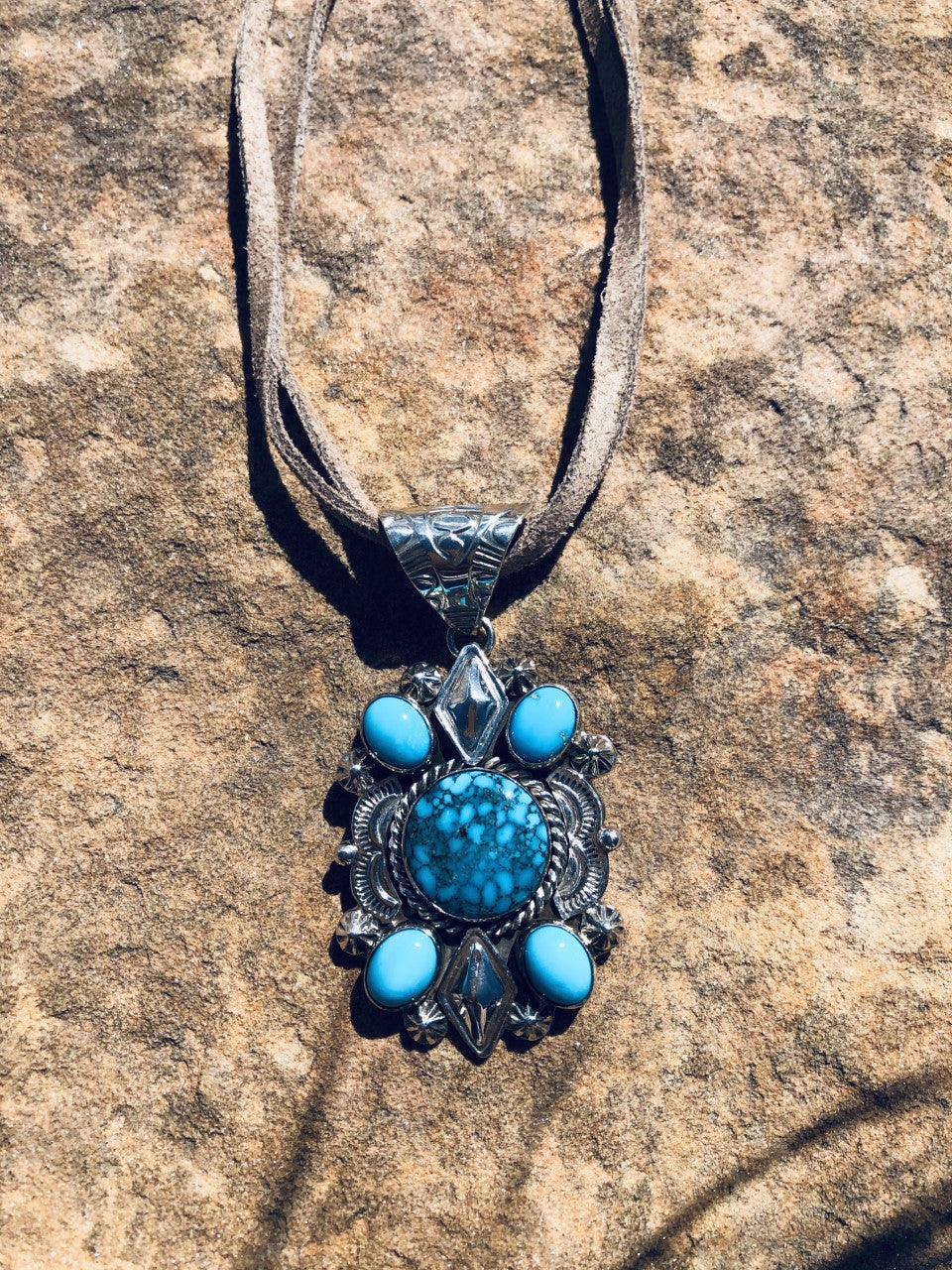 Royal web of Ithaca Peak with Sleeping Beauty Turquoise Pendant