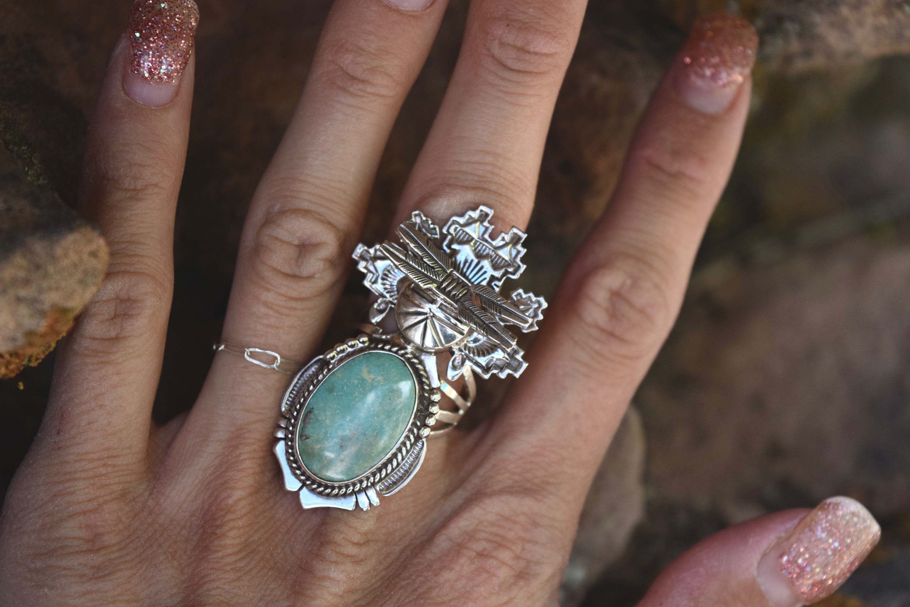 FOUR FEATHERS RING FROM THE RODGERS COLLECTION
