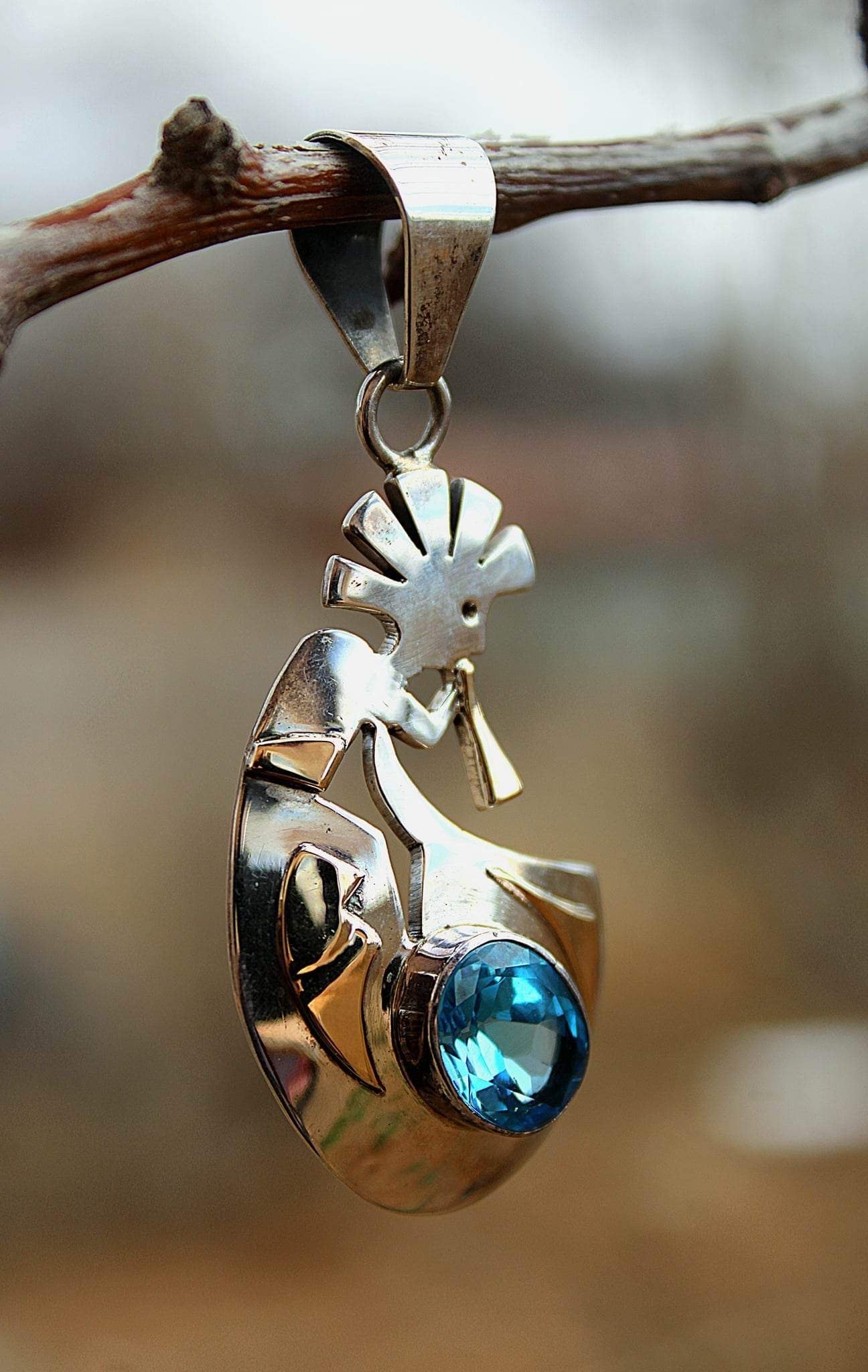 Singing Beauty Blue Topaz Pendant