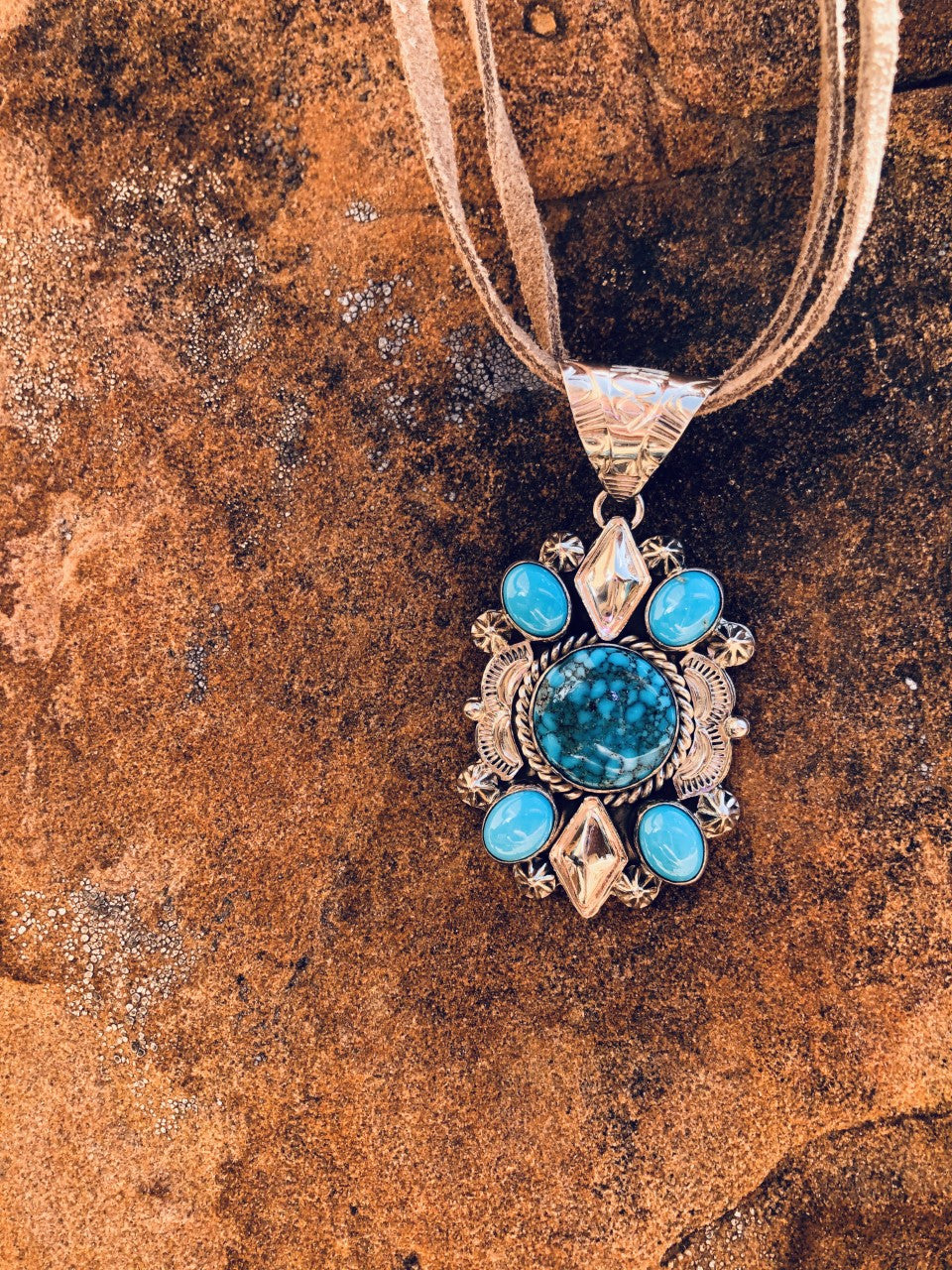 Royal web of Ithaca Peak with Sleeping Beauty Turquoise Pendant