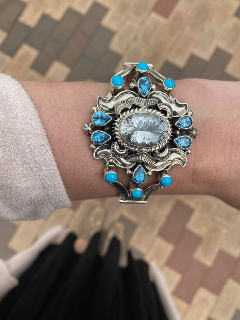 Star burst cut white topaz, swiss blue topaz, and sleeping beauty turquoise. This is a WOW piece! Created by the talented Emerson Delgarito 