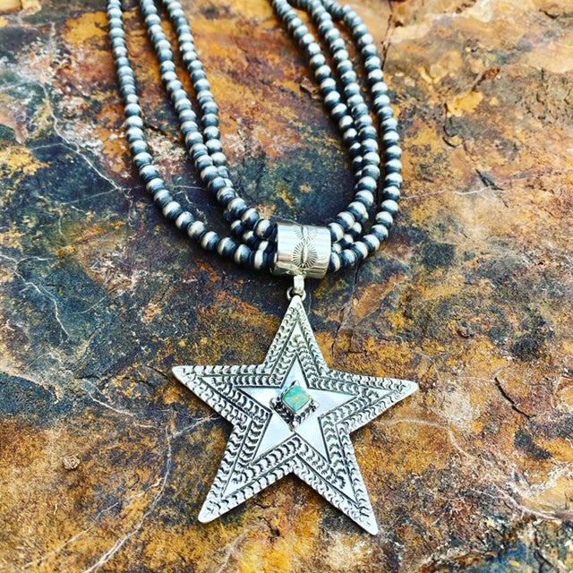 Hand stamped by the talented Jeremy Delgarito! Inlaid in your choice of Kingman blue turquoise or green ceremonial turquoise! Beads sold separate.