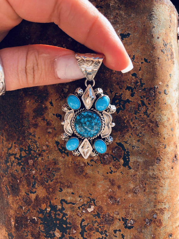 Royal web of Ithaca Peak with Sleeping Beauty Turquoise Pendant